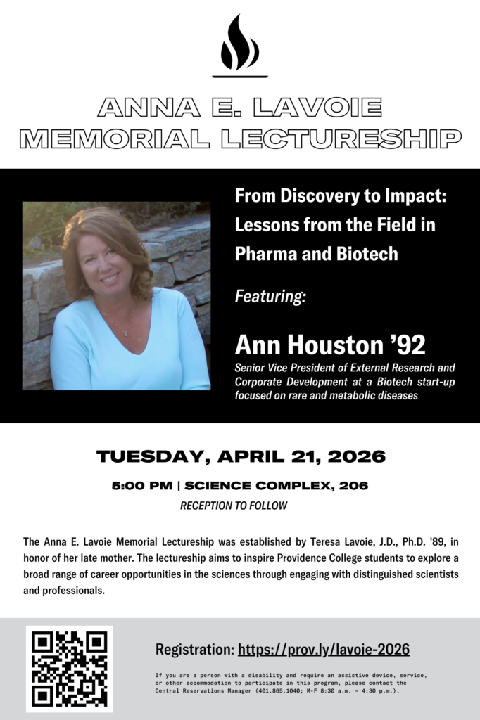 Photo of a woman with straight hair, wearing a white sweater, smiling warmly against a stone wall.